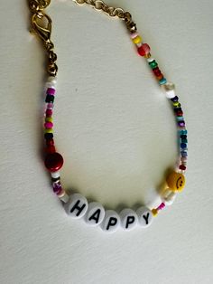 This fun and cheerful adjustable bracelet is designed to brighten your day! It features vibrant beads  along with cute smiley face beads for an extra dose of positivity. The adjustable design ensures a comfortable fit for any wrist size, making it perfect for everyday wear or as a gift to spread happiness. Ideal for anyone who loves playful and uplifting accessories! Smiley Face Beads, Cute Smiley Face, Oklahoma City, Smiley Face, Adjustable Bracelet, Brighten Your Day, Arm Band, Smiley, Favorite Jewelry