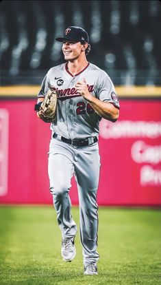 a baseball player is running on the field