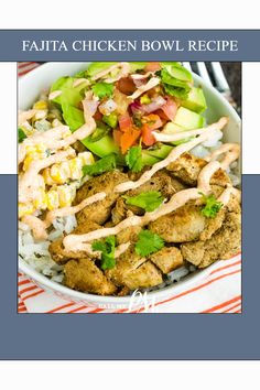 a bowl filled with chicken and rice covered in ranch dressing on top of a striped table cloth