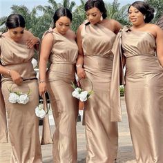 the bridesmaids are all wearing different styles of dresses