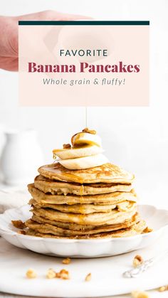 a stack of pancakes on a white plate with a sign that says favorite banana pancakes