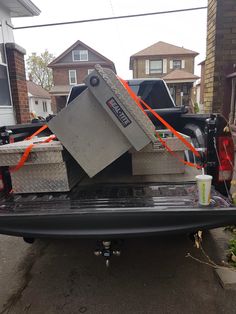 the back end of a pick up truck with an open box on it's flatbed