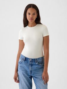 Soft, stretchy cotton-modal blend T-shirt bodysuit.  Crewneck.  Short sleeves.  Snaps at inseam.  Full coverage back.  * Fit: Slightly fitted.  Sits close to the body.  Models wearing Gap White Fitted Shirt Outfit, White T Shirt Women, Shirt Bodysuit, Body Suit Outfits, White Bodysuit, Family Pictures, White Tshirt, Shirt Outfit, White Shirt