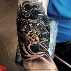 a man's arm with a clock tattoo on it, and an ink design