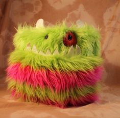 a stuffed animal that looks like a monster