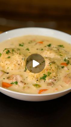 a white bowl filled with soup on top of a table