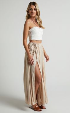 Under The Twilight Maxi Skirt - Thigh Split Skirt in Beige | Showpo USA Summer Rayon Gathered Skirt, Summer Gathered Skirt In Rayon, Chic Flowy Gathered Skirt Bottoms, Flowy Rayon Midi Skirt, Chic Flowy Gathered Skirt, Chic Rayon Pleated Skirt, Rayon Pleated Flared Skirt, Vacation Rayon Bottoms With Lined Skirt, Fitted Beige Maxi Skirt With Elastic Waistband