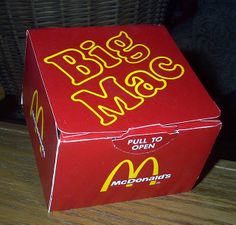 a mcdonald's big mac box sitting on the floor