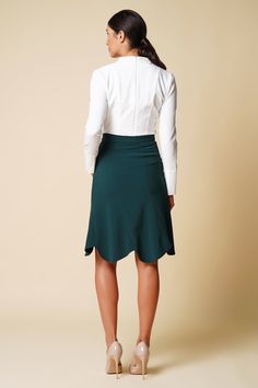 "A green skirt featuring a high-rise styling, midi length, and a trumpet silhouette. - high waist - trumpet silhouette - knee midi length - concealed back zipper closure - godet style Color: dark green Fabric: viscose - 40%, elastane - 5%, polyester - 55%. Our model wears size S (US 6) and is 178 cm / 5'8\" tall. MORE ITEMS: https://www.etsy.com/shop/TAVROVSKA?ref=hdr_shop_menu SIZE CHART XS __ EU 32 __ US 2 bust: 31,5\" | 77 cm waist: 24,5\" | 59 cm hips: 34,5\" | 84 cm XS __ EU 34 __ US 4 bust Green Knee-length Skirt For Workwear, Green Formal Midi Skirt, Green Flowy Formal Skirt, Formal Green Flowy Skirt, Green Flared Skirt For Formal Occasions, Green Midi Skirt For Workwear, Green Midi Skirt For Work, Green Midi Length Workwear Bottoms, Fitted Ruffled Midi Skirt