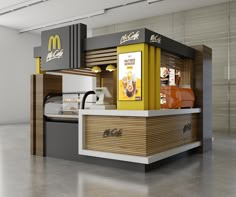 a mcdonald's fast food kiosk is shown in an empty room with concrete flooring