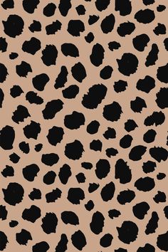 an animal print pattern with black spots