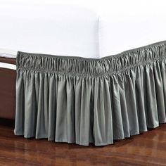 the bed skirt is made with pleated fabric