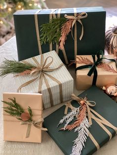 presents wrapped in green and brown paper with pine cones on them