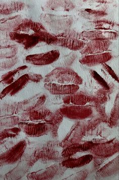 an abstract painting with red ink on white paper