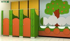 an empty public restroom with trees painted on the walls