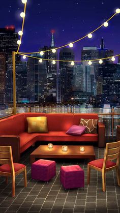 a living room with red couches and purple chairs in front of a cityscape