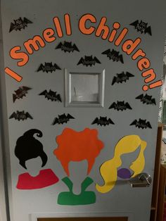 a door decorated to look like it has bats on it and the words, i smell children