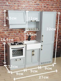 the measurements for an oven and sink are shown in front of a brick wall with white trim