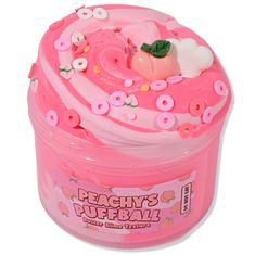 a pink plastic container filled with lots of frosting