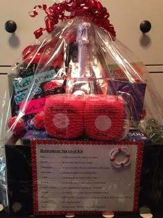 a basket filled with lots of different items on top of a counter next to a sign