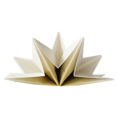 an origami flower is shown in white and gold