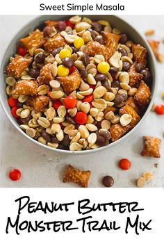 the peanut butter monster trail mix is in a bowl with candy and candies on top