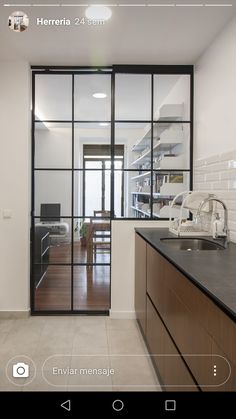 the kitchen is clean and ready to be used as a living room or dining area