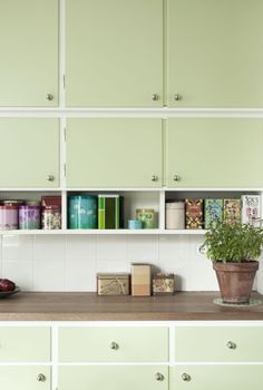 the shelves in the kitchen are filled with books and other things to put on them