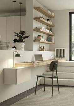 a desk with a laptop on top of it next to a chair and bookshelf