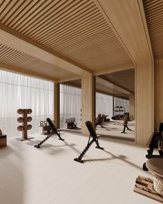 an empty gym with several exercise equipment in it