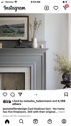 an instagram page with a fireplace in the middle and pictures on the wall above it