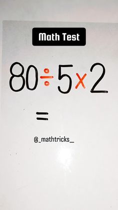 a sign that says math test on the side of a white board with black numbers