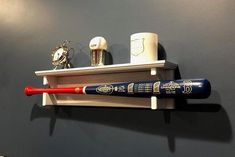 a baseball bat is mounted on a shelf