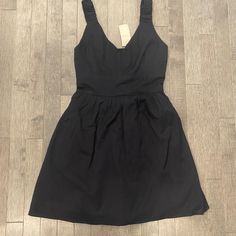 This Dress Is A Premium Outlet Exclusive. Brand New With Tag. Perfect In Every Way. Fully Lined But Still Lightweight Black Dress Has Wide Elastic Straps For An Easy Fit. Easy Pull On Style With Smocked Back. There Is A Set-In Band Underneath The Bust. 100% Cotton Body And Lining. See Photos For Approx. Chest, Under Bust And Length Measurements. The Length Was Taken From Top Of Shoulder Strap. Reliable Seller ~ Fast Shipping! Chic Black Sleeveless Cotton Dress, Fitted Cotton Black Dress, Fitted Black Cotton Dress, Black Cotton Sleeveless Sundress, Lined Cotton Dress For Date Night, Black Cotton Sleeveless Mini Dress, Cotton Lined Dresses For Night Out, Casual Cotton Evening Dress, Black Cotton Sundress