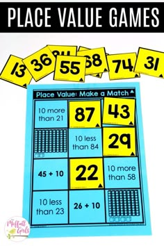 place value math game with yellow and blue numbers on the top, in front of it