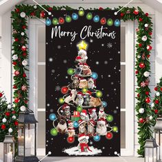 a christmas tree with cats and presents on it is hanging in front of a door