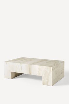 a white marble coffee table against a gray background