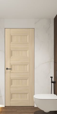 a white bath tub sitting next to a wooden door