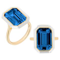 This is a unique combination of London Blue Topaz and White enamel. If you want to make a statement this is the perfect ring to do it! A 10 x 15 mm London Blue Topaz Emerald cut ring in a bezel setting, with White enamel in the borders. Gemstone: 100% Earth Mined Approx. gemstone Weight: 7 Carats (London Blue Topaz) Cut: Emerald Cut Metal: 18K Yellow Gold Luxury Polished Emerald Cut Topaz Ring, Luxury Emerald Cut Topaz Ring With Gemstone Accents, Luxury Emerald Cut Topaz Ring In Timeless Style, Luxury Emerald Cut Topaz Ring In Platinum, Luxury Emerald Cut Topaz Ring With Halo Setting, Luxury Modern Emerald Cut Topaz Ring, Luxury Emerald-cut Topaz Ring, Luxury Emerald-cut Topaz Ring For Formal Occasions, Luxury Enamel Ring With Bezel Setting