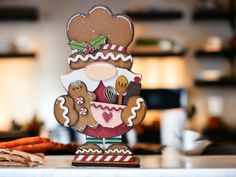 a gingerbread christmas decoration on top of a counter