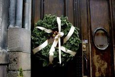 a wreath on the front door of a building