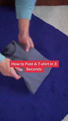 a person is using a vacuum to clean a rug with the words how to fold a t - shirt in 3 seconds