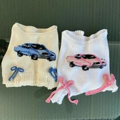 two knitted sweaters with cars on them