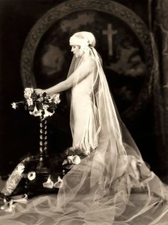 an old black and white photo of a bride