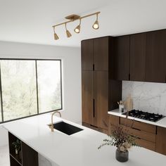 a kitchen with marble counter tops and wooden cabinets