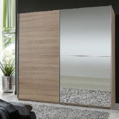 a bedroom scene with focus on the sliding door and carpeted flooring that looks like pebbles