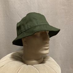 Elevate your summer style with our Dark Green Linen Bucket Hat, a versatile and handmade accessory perfect for beach days, garden outings, or any sunny adventure. This fisherman hat is not just a fashion statement; it's a practical and stylish addition to your summer wardrobe. Discover The Versatility of Our Hats: -Classic and breathable linen construction -Women's beach linen hat for a touch of elegance -Fisherman hat design for a timeless appeal -Handmade cotton hat for a personalized touch -Unisex summer hat suitable for various occasions -Ideal gift for Christmas or birthdays Discover the effortless charm of our summer linen hat, designed to provide both style and comfort. The vibrant dark green hue adds a pop of color to your ensemble, making it the perfect companion for sunny days. S Adjustable Cotton Beach Hat, Adjustable Cotton Hat For The Beach, Cotton Short Brim Hat For Beach Season, Cotton Brimmed Hat For Beach Season, Cotton Brimmed Beach Hat, Cotton Bucket Hat With Short Brim For Beach, Cotton Beach Bucket Hat With Short Brim, Wide Brim Cotton Hat For Beach Season, Cotton Wide Brim Hat For Beach Season