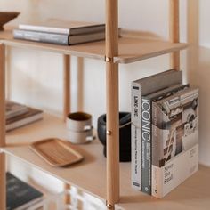 a book shelf with books and magazines on it