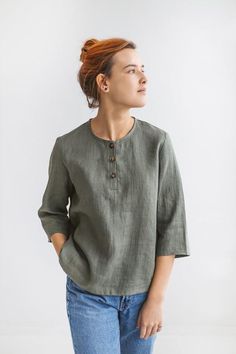 Brenda - linen collarless shirt with buttons for womenThis is a perfect loose linen blouse for summer. It has a rounded neckline and elbow-length sleeves. With such a classic linen top you'll create a stylish simple casual look.Qualities of the linen button shirt:♥ 100 % European linen♥ Natural wrinkles♥ Color in the picture - Mass green. Please choose any other color on the right.♥ Not ironed (and no need to iron to have a relaxed look).The fabric is certified 100% European linen. This guarante Linen Blouses For Women, Business Linen Button-up Tops, Linen Blouse For Work With 3/4 Sleeves, Linen Blouse Designs, Linen Blouse With Rolled Sleeves And Button-up Shape, Relaxed Fit Linen Button-up Blouse, Linen Tops With 3/4 Sleeves And Buttons, Womens Tunic Dress, Linen Shirts Women