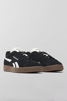 Reebok Club C Grounds UK sneakers. Reebok's iconic Club Cs with an '80s vintage feel, the Club C Grounds UK sneakers have a soft suede upper with smooth side stripes and heel tab. Features Reebok Club C Grounds UK sneakers '80s aesthetic sneakers in soft suede Lace-up style Content + Care Suede, rubber Spot clean Imported | Reebok Club C Grounds UK Sneaker in Black/Chalk/Gum, Women's at Urban Outfitters Stray Logan Shoes, Black Sneakers Platform, Cute Black Sneakers For Women, Black Suede Sneakers, Black Shoes Sneakers Women, Black Sneakers Aesthetic, Chunky Black Sneakers, Womens Black Sneakers, Womens Black Shoes